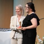 FleurMcEvoy presents a pinard to midwifery graduand Catalina Curé.